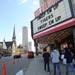 Detroit fans walk past the Fillmore marquee that reads "Sweep Em Up Tigers Sweep Em Up," before the start of Game 4 of the ALCS against the Yankees in Detroit on Thursday. 